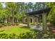 Relax under the shade of the community pergola complete with swing and lush green space at 1022 Basildon Rd, Mount Pleasant, SC 29466