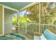 Relaxing screened porch featuring wood flooring and comfortable seating surrounded by lush greenery at 1022 Basildon Rd, Mount Pleasant, SC 29466