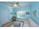 Sitting room featuring a striped couch, wicker chair, and light blue walls at 1022 Basildon Rd, Mount Pleasant, SC 29466