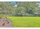 Backyard featuring spacious lawn and bench seating area at 1032 Avenue Of Oaks, Charleston, SC 29407