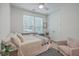 Bright bedroom with large windows, double closet and plush chair at 1032 Avenue Of Oaks, Charleston, SC 29407