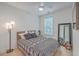 Bright bedroom features a ceiling fan, a window, and a full length mirror at 1032 Avenue Of Oaks, Charleston, SC 29407