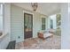 Charming front porch with comfortable seating and stylish decor, perfect for relaxing and enjoying the outdoors at 1032 Avenue Of Oaks, Charleston, SC 29407