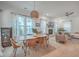 Bright living room featuring a dining area, fireplace, and open layout, perfect for entertaining and relaxation at 1032 Avenue Of Oaks, Charleston, SC 29407