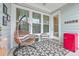 Inviting covered porch with comfortable seating, stylish decor, and a relaxing atmosphere at 1032 Avenue Of Oaks, Charleston, SC 29407