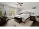 Inviting bedroom with wooden floors, accent wall, and a comfortable upholstered bed at 106 Abigale Ln, Summerville, SC 29483