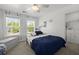 Bright bedroom with windows, ceiling fan, and playful wall decor at 106 Abigale Ln, Summerville, SC 29483