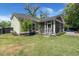 Exterior of home with a screened in porch, lush green yard and partial view of a pool at 106 Abigale Ln, Summerville, SC 29483