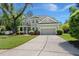 Charming two-story home with well-manicured lawn and mature trees at 106 Abigale Ln, Summerville, SC 29483