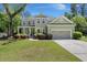 Charming two-story home with well-manicured lawn and mature trees at 106 Abigale Ln, Summerville, SC 29483