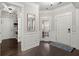 Bright entryway with hardwood floors, white wainscoting, and a coat rack at 106 Abigale Ln, Summerville, SC 29483