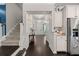 Hallway featuring a staircase, white cabinetry, and an open view of the front door at 106 Abigale Ln, Summerville, SC 29483