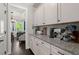Kitchen with counter, cabinets, and appliances; a glimpse of the living area through the door at 106 Abigale Ln, Summerville, SC 29483