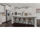 Kitchen features an island with seating, stainless steel appliances, and white cabinetry at 106 Abigale Ln, Summerville, SC 29483