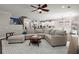 Open living space showcasing a large gray sectional couch and a view of the kitchen at 106 Abigale Ln, Summerville, SC 29483