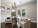 Cozy sitting area with hardwood floors, a chandelier, and two comfortable armchairs at 106 Abigale Ln, Summerville, SC 29483