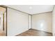 This bedroom features neutral walls, wood-look flooring, a flush mount ceiling light, and an interior door at 1086 Arrowhead Rd, Saint Stephen, SC 29479