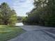 Community boat ramp for easy access to the river, set against a backdrop of trees and lush green grass at 1086 Arrowhead Rd, Saint Stephen, SC 29479