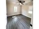 This bright bedroom offers ample natural light and a ceiling fan fixture at 109 Alexander St, Walterboro, SC 29488