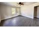 Spacious bedroom boasts luxury vinyl floors, a ceiling fan, and a convenient outdoor access door at 109 Alexander St, Walterboro, SC 29488