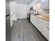 Well-lit kitchen features wood counters, white cabinets, and stainless steel oven at 109 Alexander St, Walterboro, SC 29488