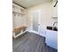 Bright mudroom includes a built-in bench, coat hooks, and a sink in a bright and airy space at 109 Alexander St, Walterboro, SC 29488
