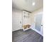 Mudroom with built-in bench with storage, coat hooks, and access to exterior door at 109 Alexander St, Walterboro, SC 29488