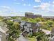 Beautiful aerial view of a residential community with waterfront views and lush landscaping at 11 Harleston Pl, Charleston, SC 29401