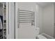 Bathroom featuring modern chrome towel warmer and convenient access to the closet at 11 Harleston Pl, Charleston, SC 29401