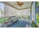Cozy back porch with comfortable seating, blinds, and a relaxing ambiance at 110 Angelica Ave, Summerville, SC 29483
