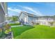 Beautiful backyard featuring artificial turf, a storage shed, a fenced area, and mature trees in the neighborhood at 110 Angelica Ave, Summerville, SC 29483