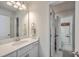 Clean and bright bathroom with a marble vanity and a doorway leading to other rooms at 110 Angelica Ave, Summerville, SC 29483