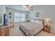 Comfortable bedroom featuring a queen bed, wooden furniture, and a ceiling fan for added comfort at 110 Angelica Ave, Summerville, SC 29483