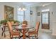 Charming dining area with a round table, decorative chandelier, and natural light at 110 Angelica Ave, Summerville, SC 29483