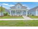 Charming two-story home with a welcoming front porch and well-maintained landscaping at 110 Angelica Ave, Summerville, SC 29483