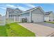 View of the garage with a white door, blue siding, and fenced yard at 110 Angelica Ave, Summerville, SC 29483