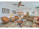 Open-concept living room with stylish furnishings, ceiling fan, and view of the kitchen at 110 Angelica Ave, Summerville, SC 29483