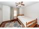 Cozy bedroom features a ceiling fan, wood floors, and a patterned area rug at 110 Wallace Rd, Goose Creek, SC 29445