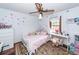 Charming bedroom with hardwood floors, a ceiling fan, and a decorative butterfly wall at 110 Wallace Rd, Goose Creek, SC 29445