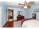 This bedroom boasts wood floors, a ceiling fan, and a full dresser with mirror at 110 Wallace Rd, Goose Creek, SC 29445