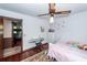 Bright bedroom with hardwood floors, ceiling fan and a view into an adjacent room at 110 Wallace Rd, Goose Creek, SC 29445
