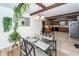 Bright dining area with wood beams, unique chandelier, and beautiful decor and light from windows at 110 Wallace Rd, Goose Creek, SC 29445
