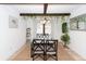 Elegant dining area with wood beams, decorative greenery, and natural light from window at 110 Wallace Rd, Goose Creek, SC 29445