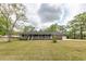 Charming brick home features a long, covered front porch and a well-manicured lawn at 110 Wallace Rd, Goose Creek, SC 29445