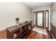 Beautiful foyer with dark hardwood floors, decorative table, and stained glass front door at 110 Wallace Rd, Goose Creek, SC 29445
