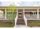 Welcoming front porch with a cozy atmosphere and classic brick facade at 110 Wallace Rd, Goose Creek, SC 29445
