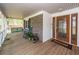 Enjoy outdoor living on the expansive front porch with rocking chairs and swing at 110 Wallace Rd, Goose Creek, SC 29445