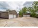 Brick home's three-car garage and a separate two-car garage offer plenty of parking and storage space at 110 Wallace Rd, Goose Creek, SC 29445