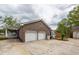 Attached three-car garage of the home and the detached two-car garage offer plenty of parking and storage at 110 Wallace Rd, Goose Creek, SC 29445