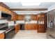 Charming kitchen featuring stainless steel appliances, wood cabinets, and stylish backsplash at 110 Wallace Rd, Goose Creek, SC 29445